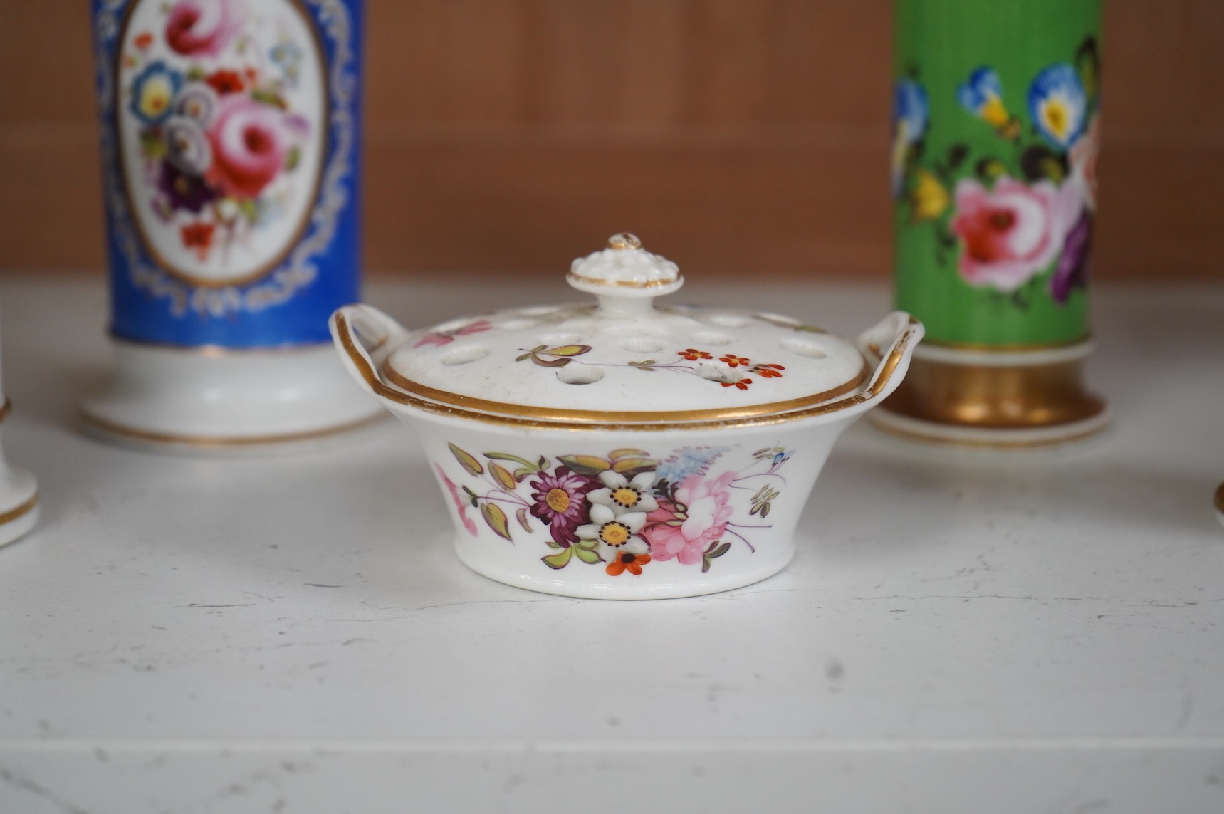 An early 19th century English porcelain miniature pot pourri basket and cover and three spill vases decorated with birds and flowers, largest 11cm high